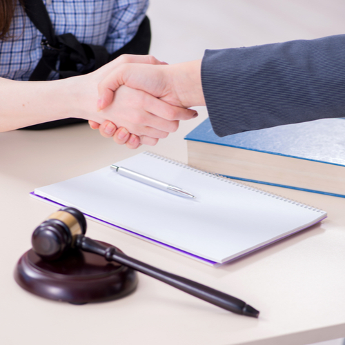 injured client and Danbury personal injury lawyer shaking hands