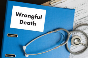 Image is of a wrongful death lawsuit folder and stethoscope on desk of a Bridgeport wrongful death lawyer.